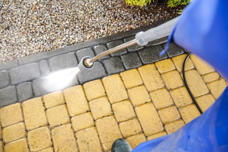 driveway-bricks-pavement-washing-using-pressure-washer-closeup-photo