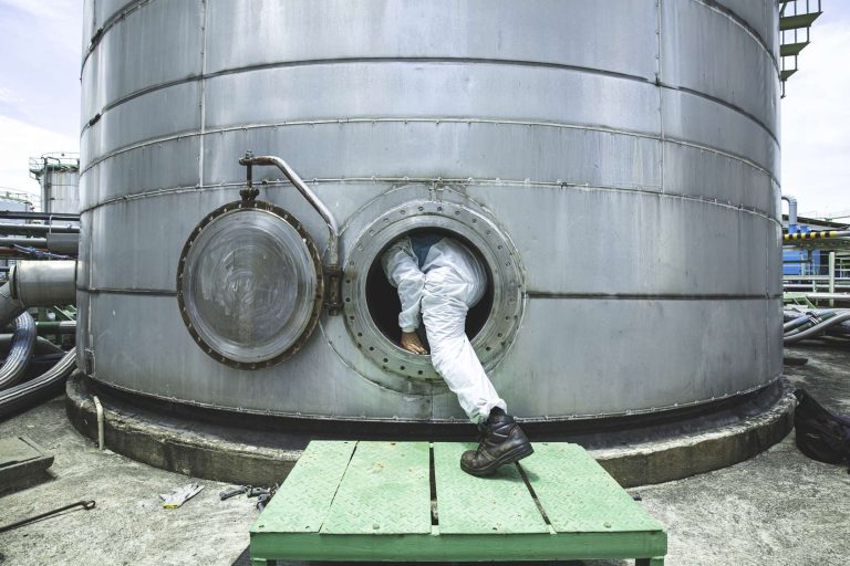 male-protective-suit-worker-into-manhole-fuel-stainless-tank-chemical-protective-area-confined-space-dangerous